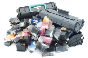 Pile of used toner and ink cartridges for printers