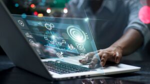 Close up of an office worker on a computer with icons representing managed IT services